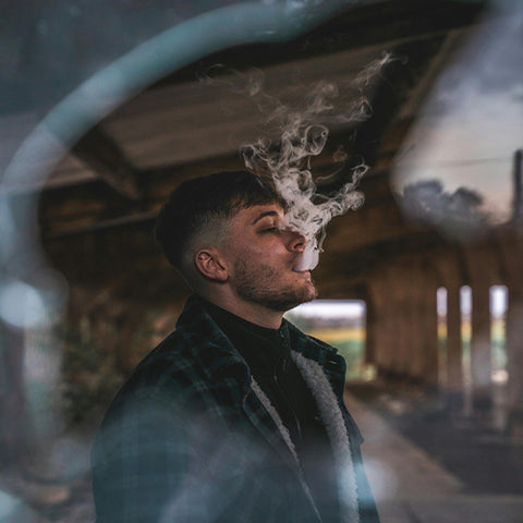 Man blowing vapor