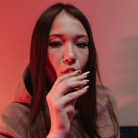 Woman Taking Puff From Vape