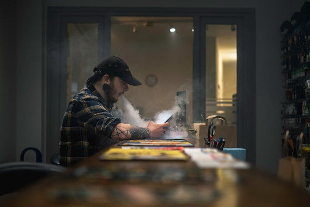 a man vaping at a bar for does vape juice expire