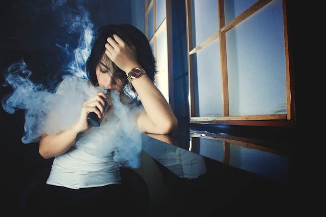 a woman vaping