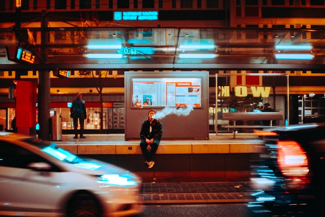someone vaping at a bus stop for how much nicotine is in a elf bar